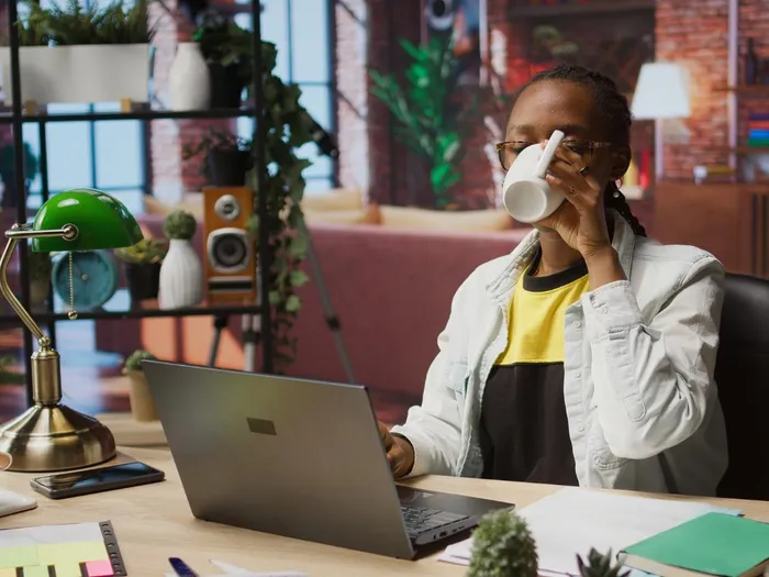 A small business owner working at her desk
